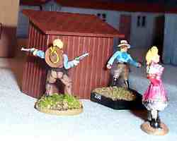 Nevada Nell skulks with her gang behind the outhouse, planning to take over the town.
